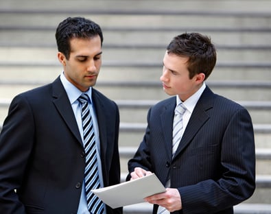 Men discussing certification